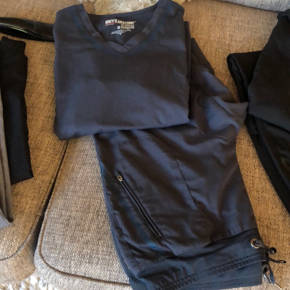 Greys anatomy scrubs. Two sets (top and bottom) pewter grey/ black. Size Medium